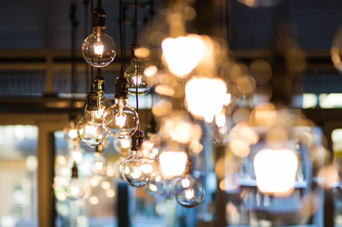 Illustrative photo of warm pendant bulbs. Not a Brite Sparx lighting installation.
